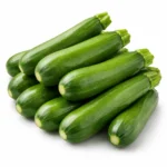 Fresh local green zucchini on white background | كوسا خضراء محلية طازجة بخلفية بيضاء